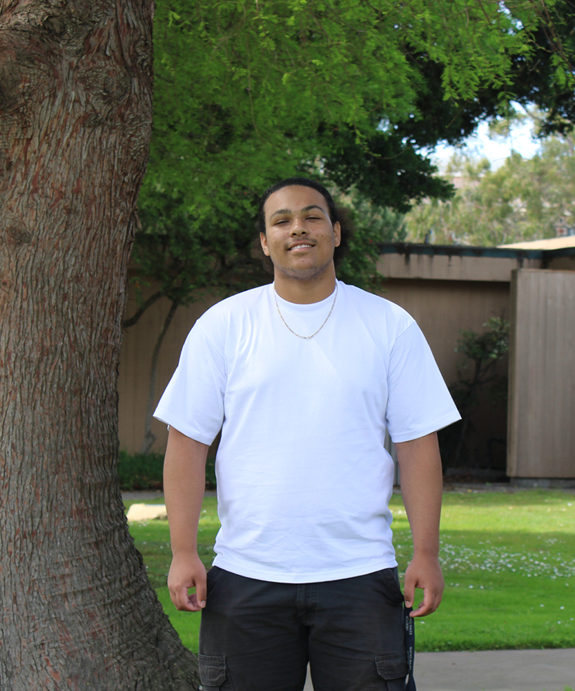 This is a headshot of Guardian Scholar Intern, Ashtin. Ashtin wears a crisp, white t-shirt.