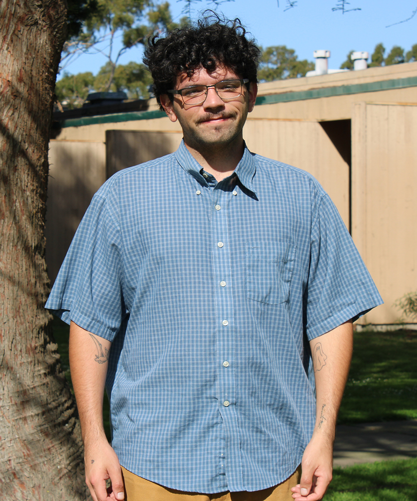 This is a headshot of Guardian Scholar Intern, Jonah. Jonah wears glasses and a blue button up.